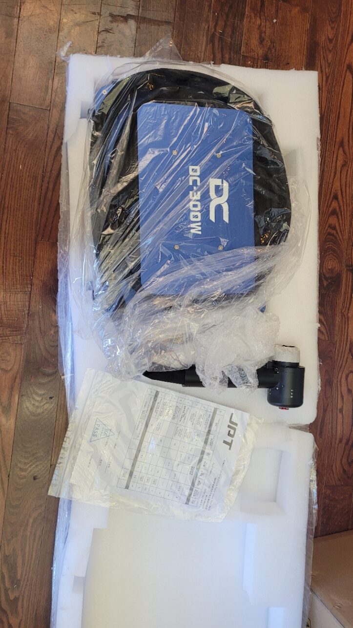 Blue laser cleaner and cleaning head unpacked in protective foam
